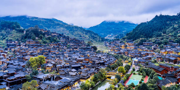 High View Night Scenery of Miao Village in Xijiang, Guizhou, China High View Night Scenery of Miao Village in Xijiang, Guizhou, China qiandongnan miao and dong autonomous prefecture stock pictures, royalty-free photos & images