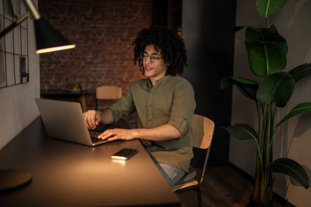 istock Man sitting at the table and having a video call 2017429112