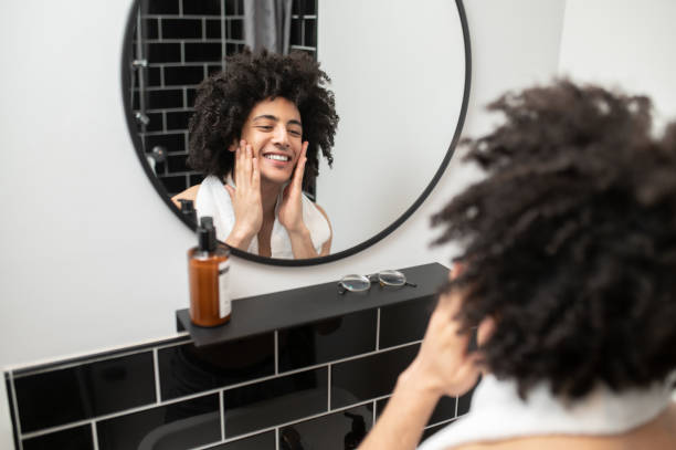 istock Brunette curly-haired man having morning procedures in the bathroom 2017430194