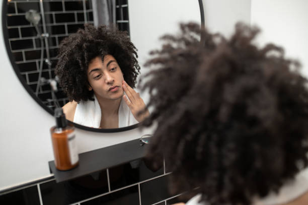 istock Brunette curly-haired man having morning procedures in the bathroom 2017430195