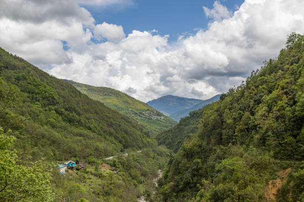 istock High mountains slopes covered in thick virgin forest and shrouded in cloud near the small village of senge near tawang in western arunachal pradesh, India. 2017522498