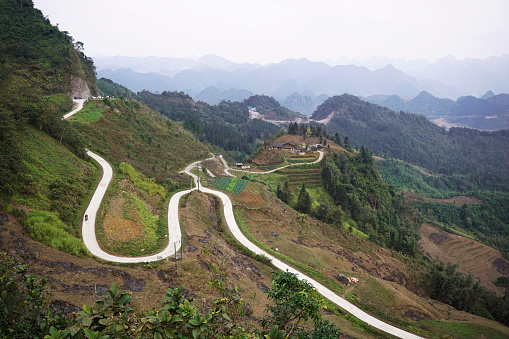 Road of Ha Giang Loop going through the mountains