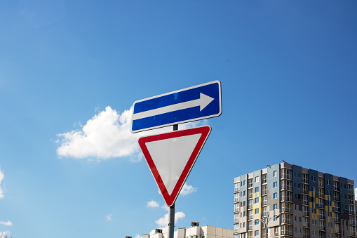 Secondary road road sign and arrows close up