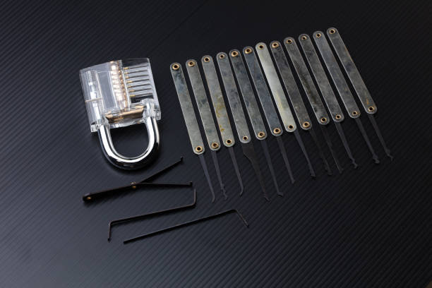 istock Clear Lock device over black background to show mechanic inside lock. Many lock pick tool to unlock key of door window vehicle for thief lockpick burglar. 2017535605