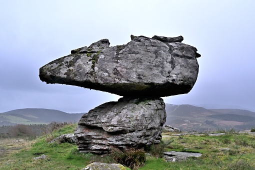 This is an isolated stone in the Dunbria mountains of La Coruna, Spain, which is a tourist attraction.