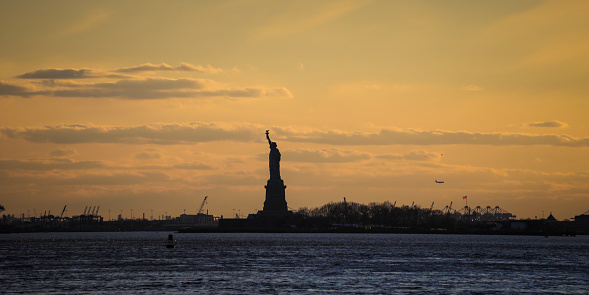 The Statue of Liberty silhouette Manhattan skyline skyline New York city sunset