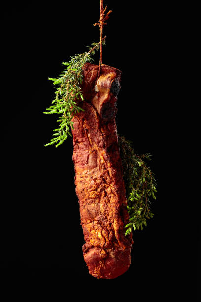 istock Homemade smoked pork ribs with juniper branches. 2017580844