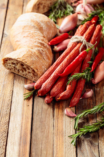 istock Smocked sausages with onion, garlic, pepper, and rosemary. 2017581396
