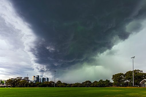 Severe thunderstorm over Melbourne eastern suburbs at Box Hill on Tuesday Feb 13, 2024. This severe storm caused havoc in the city and surrounding suburbs and nearby regions with widespread damage to the power network causing extensive blackouts. The green areas in the storm indicates the presence of ice and large hail. Box Hill business centre provides a focus for the dramatic image.