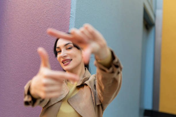 istock woman gesturing with fingers framing 2017645340