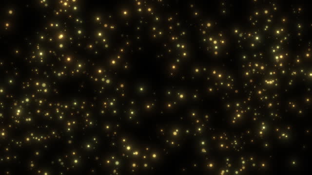 Background with golden glittering particles floating in the air.