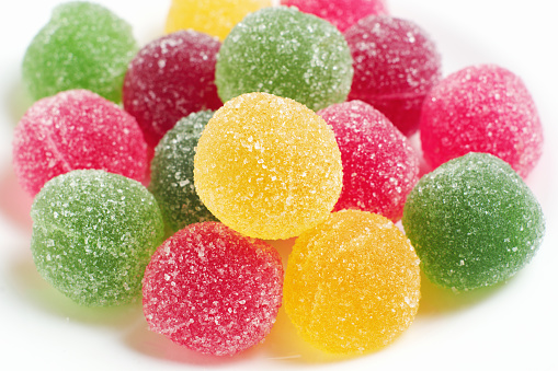 Multi colored candies marmalade on white background. Sweet jujube balls