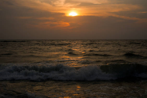 Sunrise on the beach in Colombo, Sri Lanka.