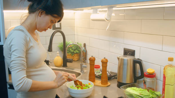 istock Young woman preparing healthy organic vegetables 2017695576