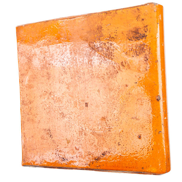 istock Old glazed furnace tile isolated on white background 2017697164