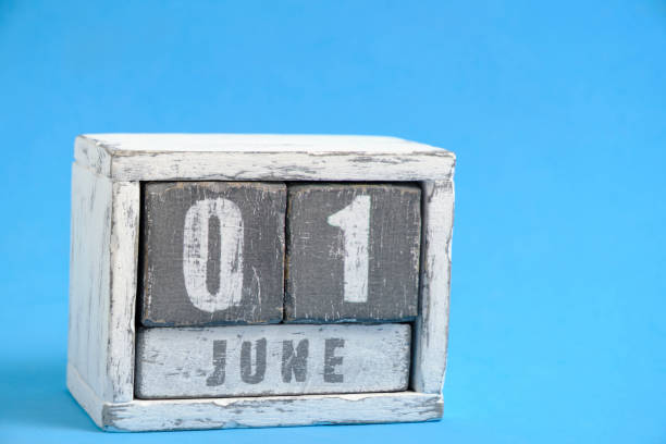 istock Calendar for June 01 made wooden cubes standing blue background. With empty space for text. 2017754432