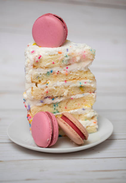 Slice of cake and macarons