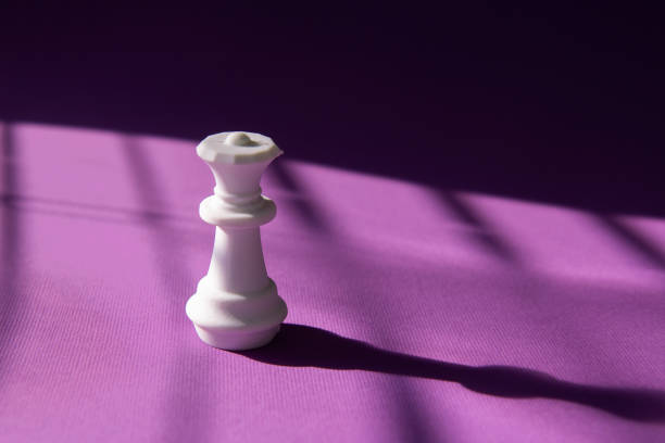istock White chess queen on a purple background. Abstract background. Chess piece 2017783218