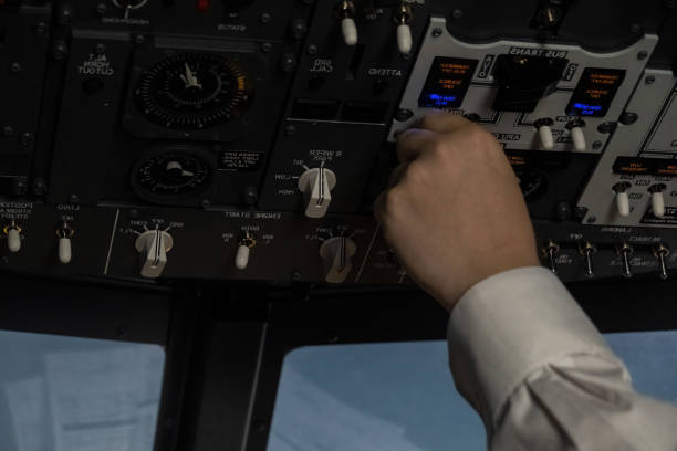 istock Captain manages intricate components of cockpit during flight 2017796639