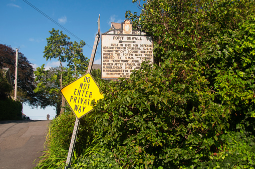 the sign for a the historic Fort Seawall in Marblehead Massachusetts on a sunny summer day.