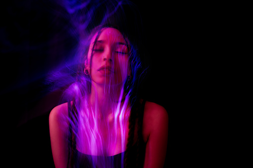Portrait of woman with long exposure light painting