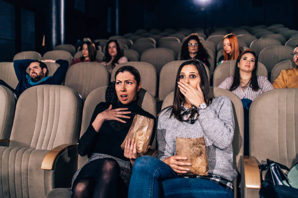istock Group of people watching scary movie 2017825856