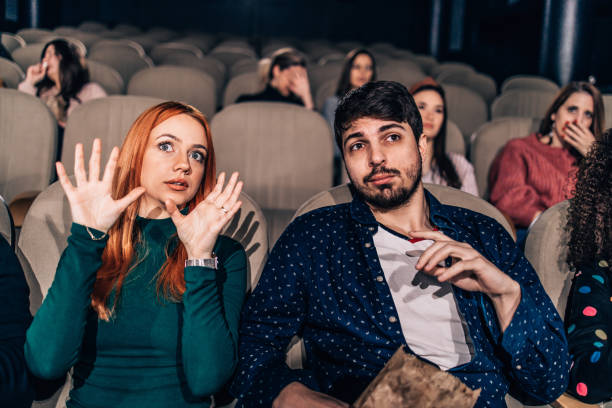 istock Group of people watching scary movie 2017826403