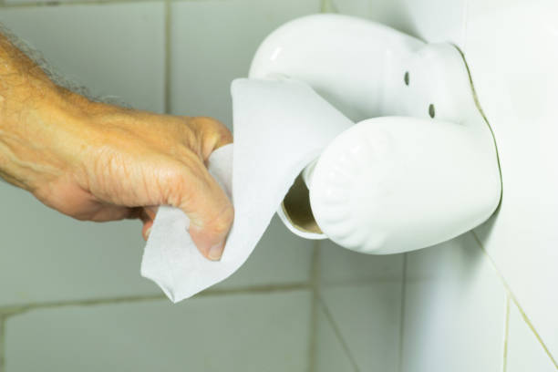 istock Hand pulling the end of a toilet paper roll 2017826828