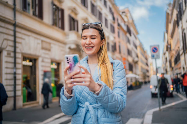 istock Woman using phone in the city 2017829092