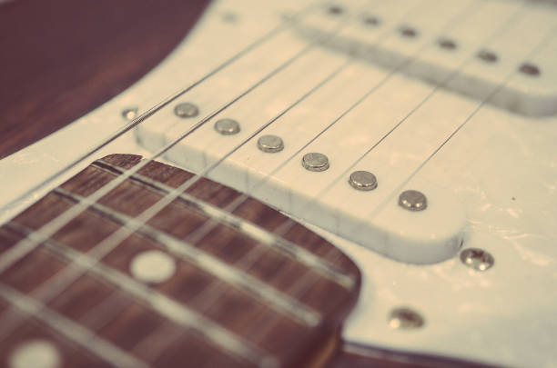 a guitar with a music book. with space for the text. close-up. lifestyle. flat lay
