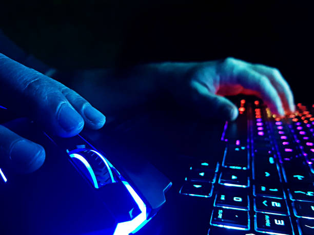 istock Gamer concept, hands on keyboard playing an online game 2017834595