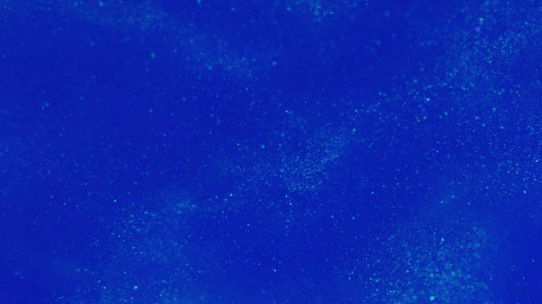 istock Particles background defocused glitter blue water 2017837852