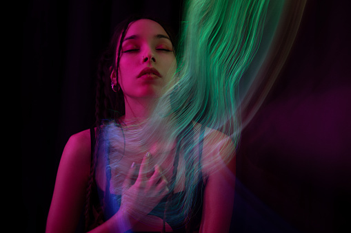 Portrait of woman with long exposure light painting