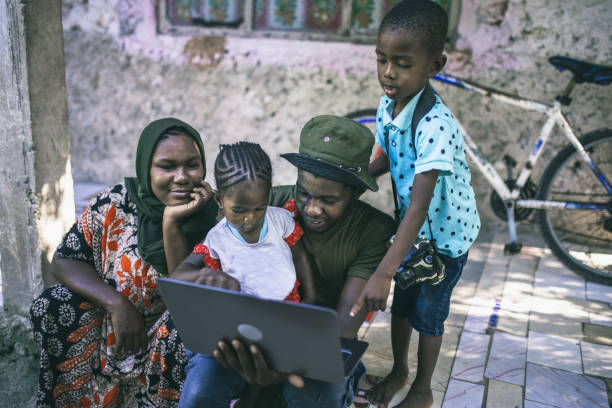 istock young African family with two children using a laptop 2017866438