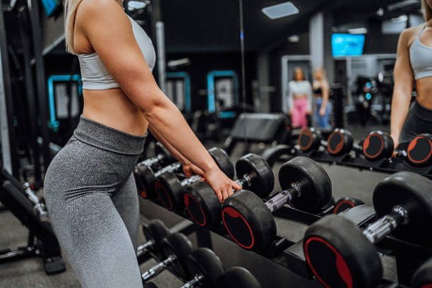 istock Woman taking a dumbbell 2017873104