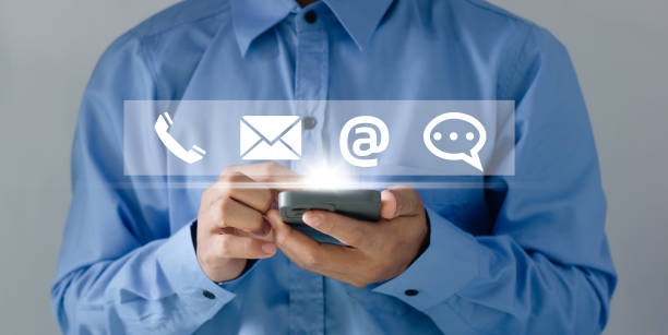 istock Businessman using Smart Phone with the email, call phone, address, Chat message icons.Customer support hotline Contact us people connection. 2017900004