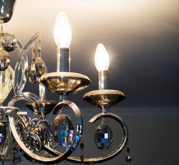 istock crystal chandelier with glowing light bulbs hanging from the ceiling 2017905904