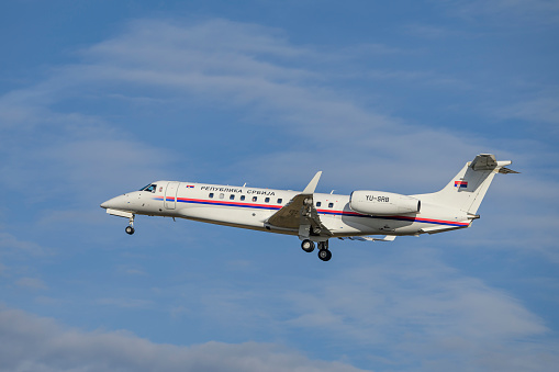 Munich, Germany - February 16. 2024 : 
Republic of Serbia Embraer EMB-135BJ Legacy 
with the aircraft registration YU-SRB 
lands as part of the Munich Security Conference 2024,
on the south runway 26L of Munich Airport MUC