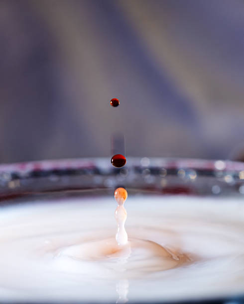 istock abstract picture with colored drop of various shapes, blurred background, water drop splash, grainy water texture 2017959104