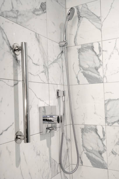 istock close up on shower in the bathroom 2017999450