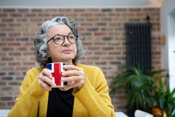 istock Mature woman having a coffee break at home 2018013532