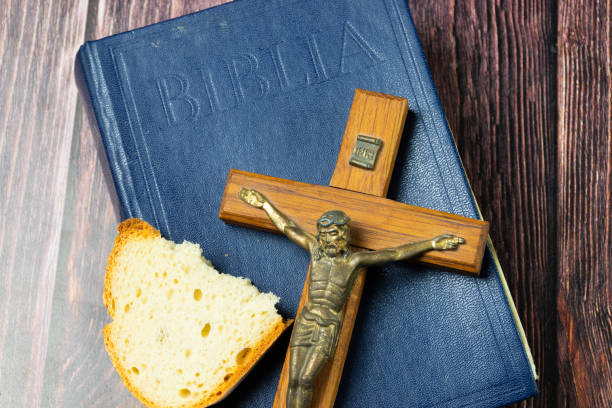 istock Crucifix and bread on a Holy bible 2018028906