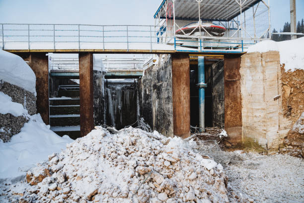 istock An old dam on the river in a ruined state, a sluice for discharging water, a concrete structure, a dam. 2018030280