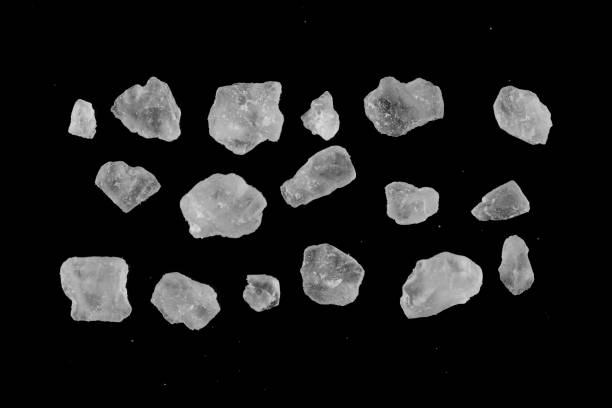 istock Sea salt crystals isolated on black background. 2018061202