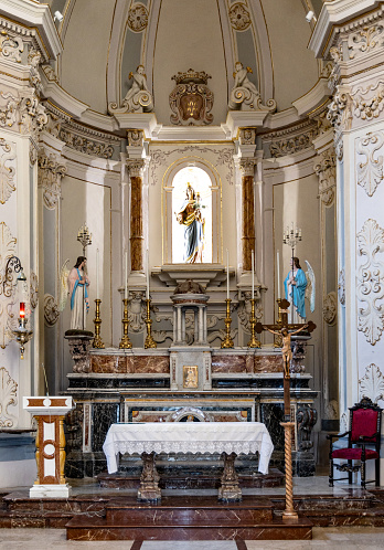 Taormina, Sicily, Italy - February 15, 2023: Main nave and presbytery of Saint Joseph Church Chiesa di San Giuseppe at Piazza IX Aprile square of Taormina old town in Messina region