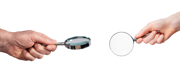 Magnifier, magnifying glass, lens in hands isolated on white background
