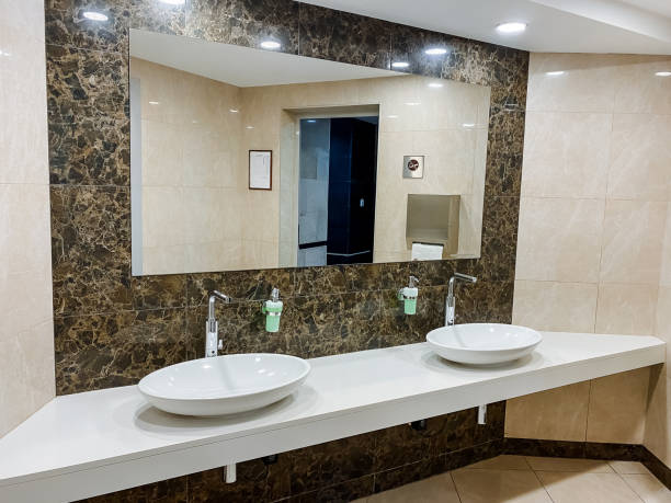 istock A contemporary bathroom featuring double sinks and a spacious mirror for a stylish interior design. 2018075874