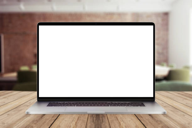 istock Laptop with white screen mockup display on wooden desktop with office view. Creative idea and work in office 2018078527