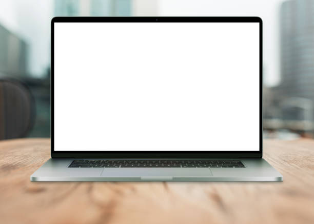 istock Laptop with white screen mockup on desktop with urban view. Creative idea and work in office 2018079617