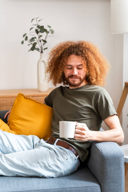 istock Content Man Holding Mug at Home 2018084327